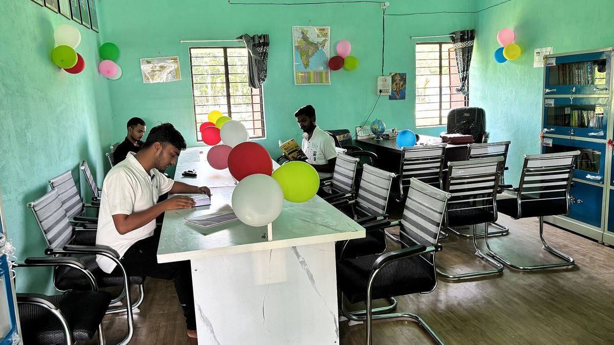 Students reading at a village public library in Bhiswa, India