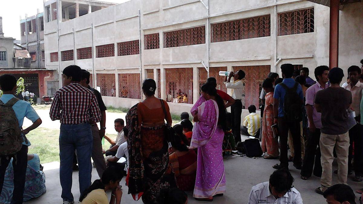 Candidates waiting outside an entrance exam centre in Howrah on exam day