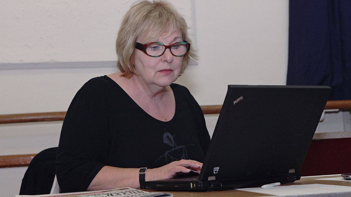 A woman working on a laptop